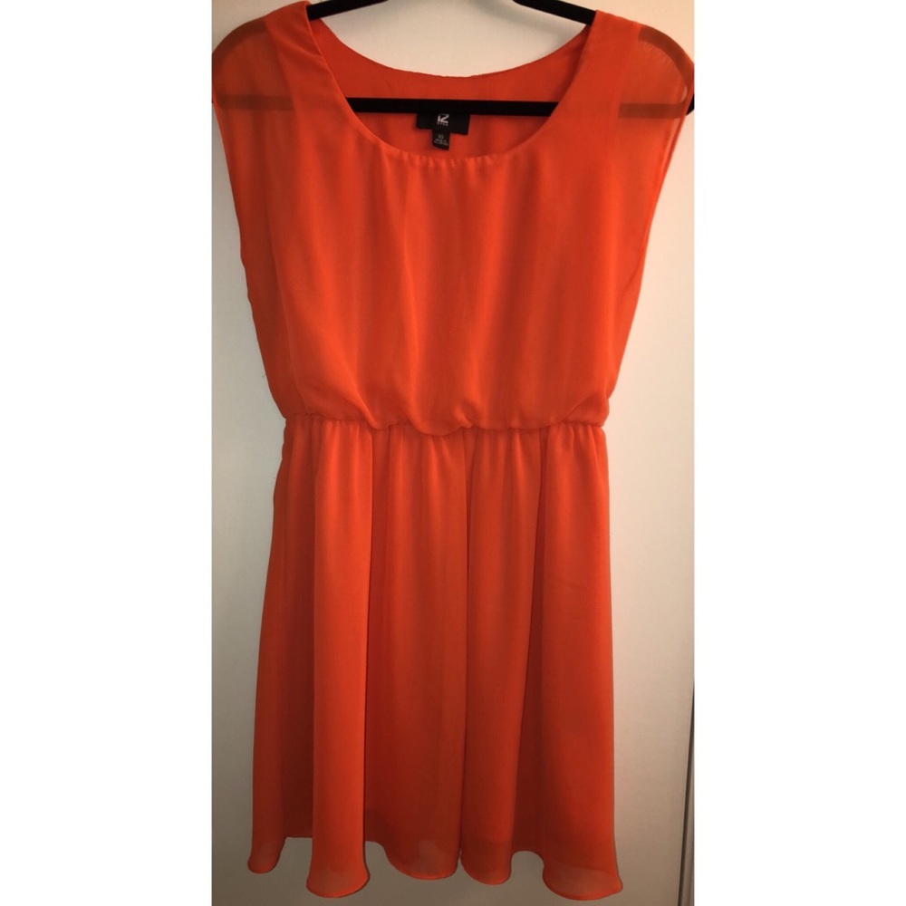 Orange dress, small stain on front.
